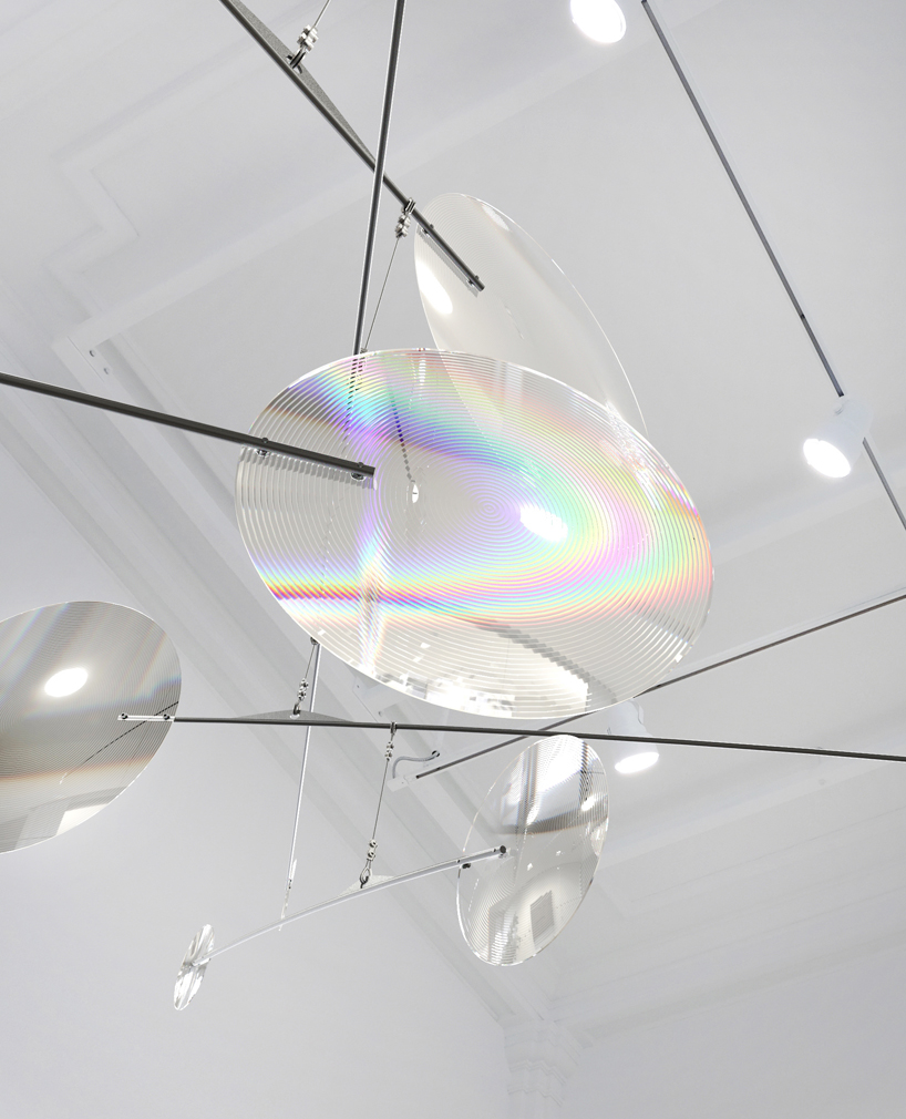 vincent leroy filters reality with 'floating lens' installation on parisian rooftops