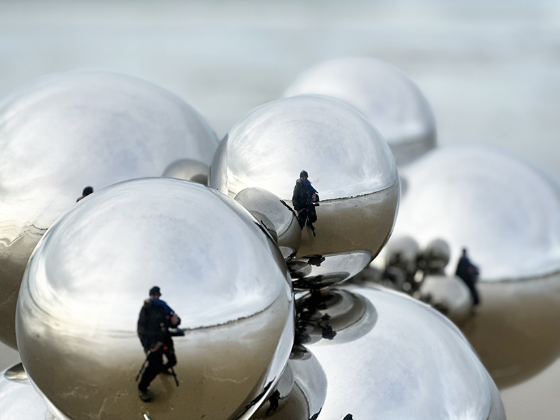 vincent leroy's kinetic mirror cloud floats between earth and sky at normandy beach