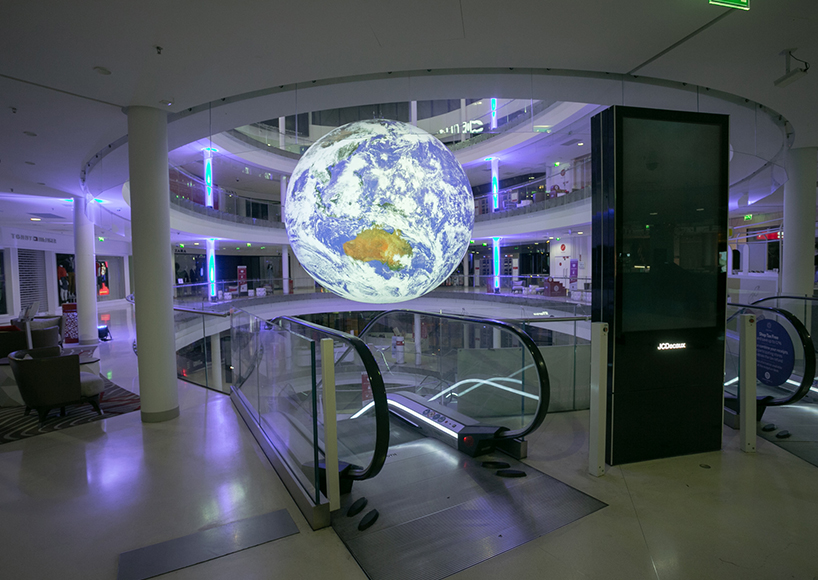 luke jerram + tetro put parisian shopping mall into orbit with globe installation