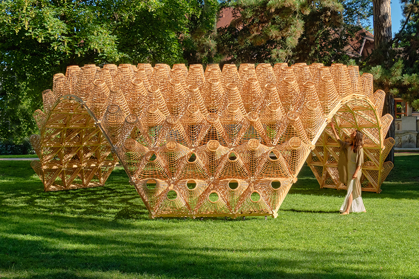 DJA introduces triangular wicker mesh pavilion in france, weaved by latvian craftsmen