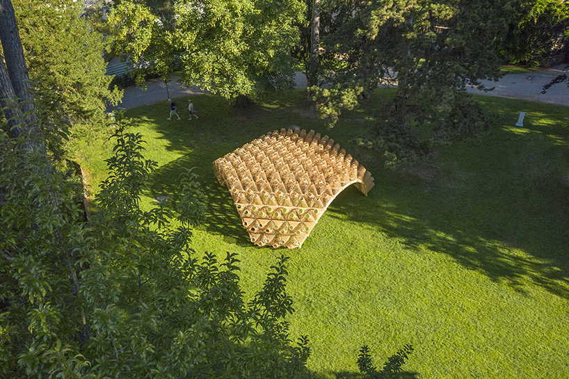 DJA introduces triangular wicker mesh pavilion in france, weaved by latvian craftsmen