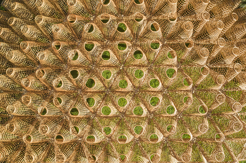 DJA introduces triangular wicker mesh pavilion in france, weaved by latvian craftsmen