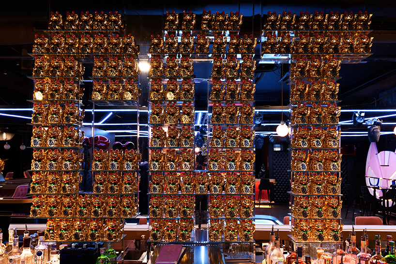 kissmiklos applies colorful illustrations to design CAT bar and dance club in budapest designboom