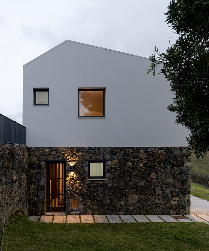 mezzo atelier completes concrete + local basalt stone dwelling in são miguel island