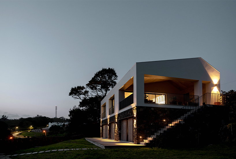mezzo atelier completes concrete + local basalt stone dwelling in são miguel island