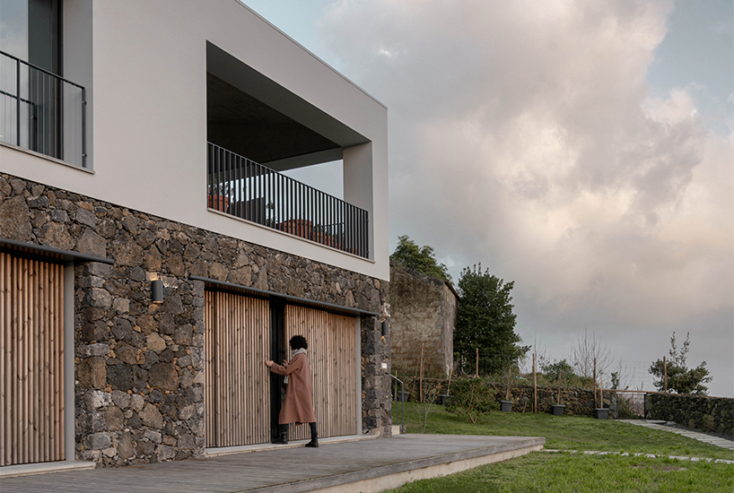 mezzo atelier completes concrete + local basalt stone dwelling in são miguel island