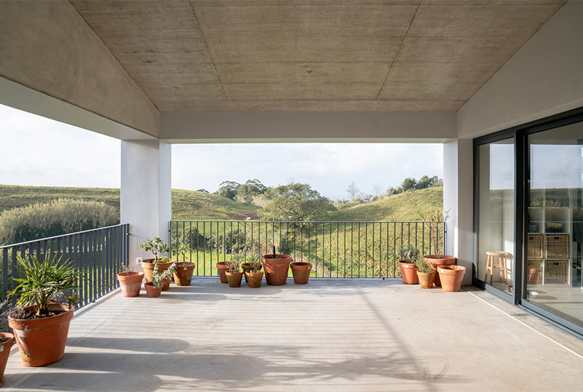 mezzo atelier completes concrete + local basalt stone dwelling in são miguel island