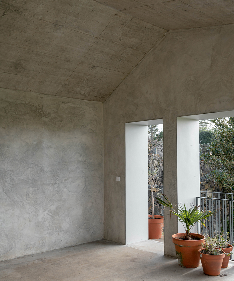 mezzo atelier completes concrete + local basalt stone dwelling in são miguel island