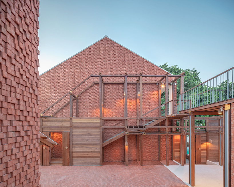 handmade bricks form the 'baan pomphet' restaurant and hotel in ayutthaya, thailand designboom