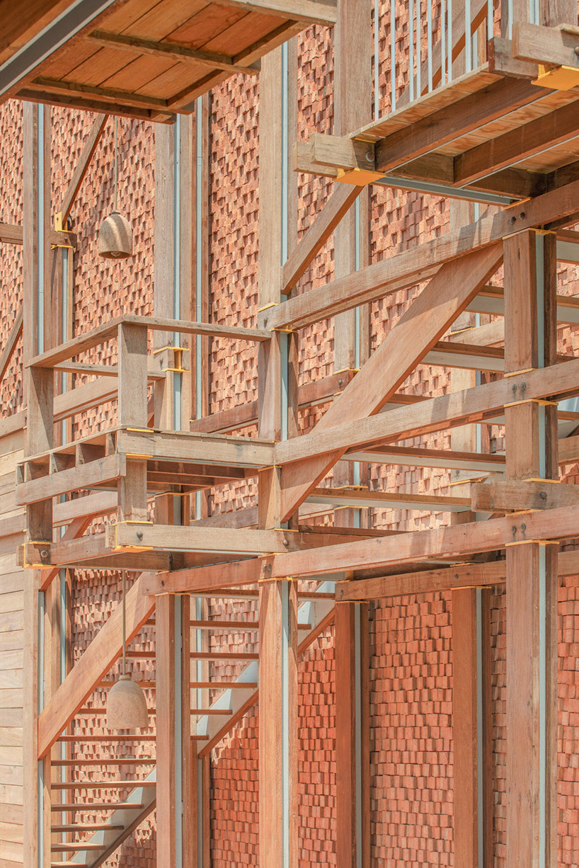 handmade bricks form the 'baan pomphet' restaurant and hotel in ayutthaya, thailand designboom