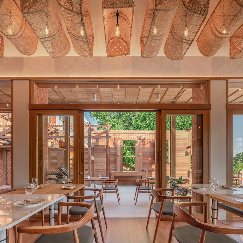 handmade bricks form the 'baan pomphet' restaurant and hotel in ayutthaya, thailand designboom