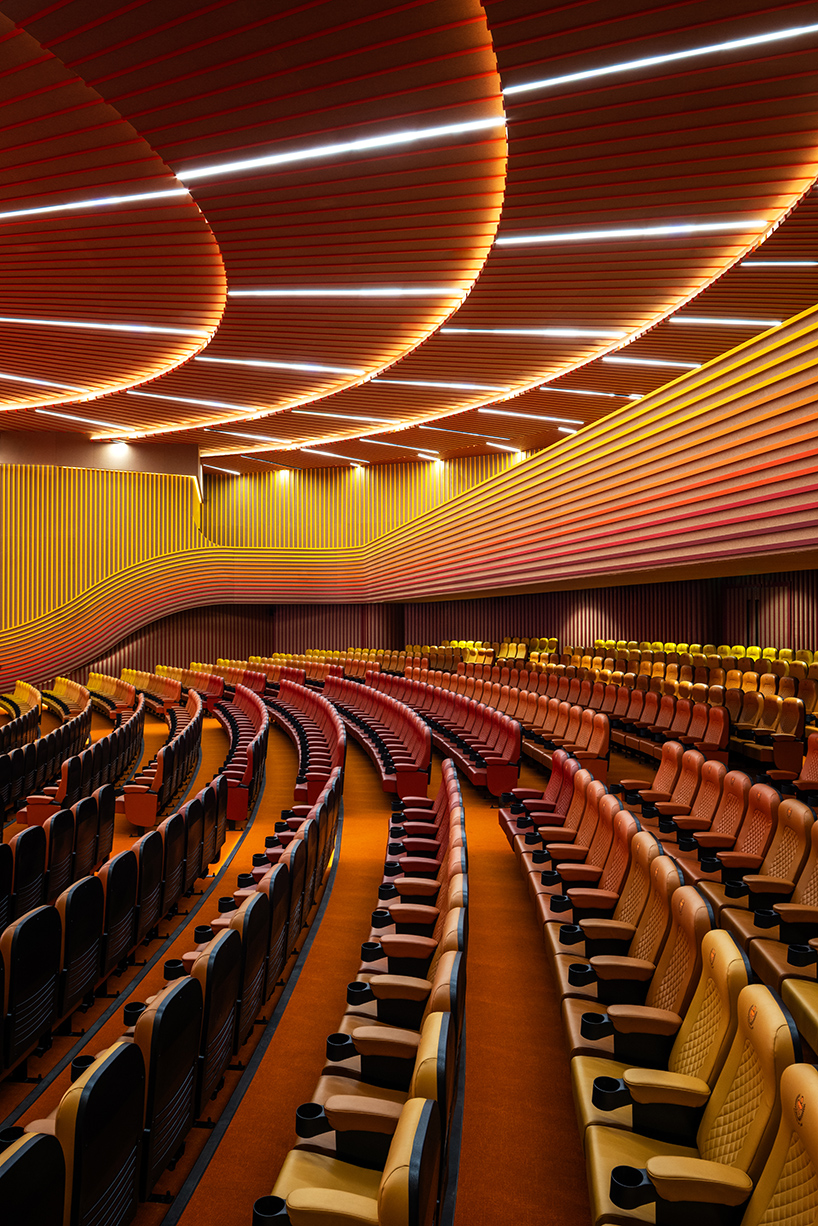 purple ink studio's winding ramps connect concentric plaza to auditorium at university campus in bangalore