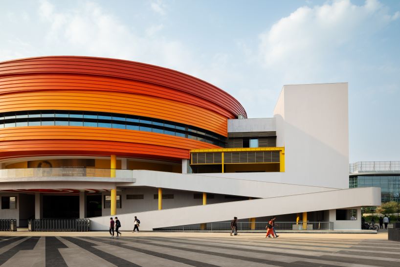 purple ink studio's winding ramps connect concentric plaza to auditorium at university campus in bangalore