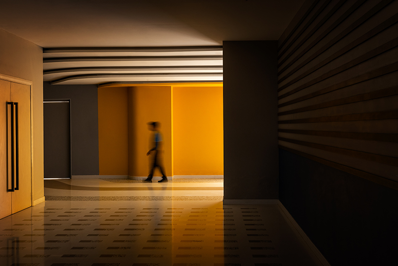 winding ramps connect concentric plaza to auditorium at university campus in bangalore
