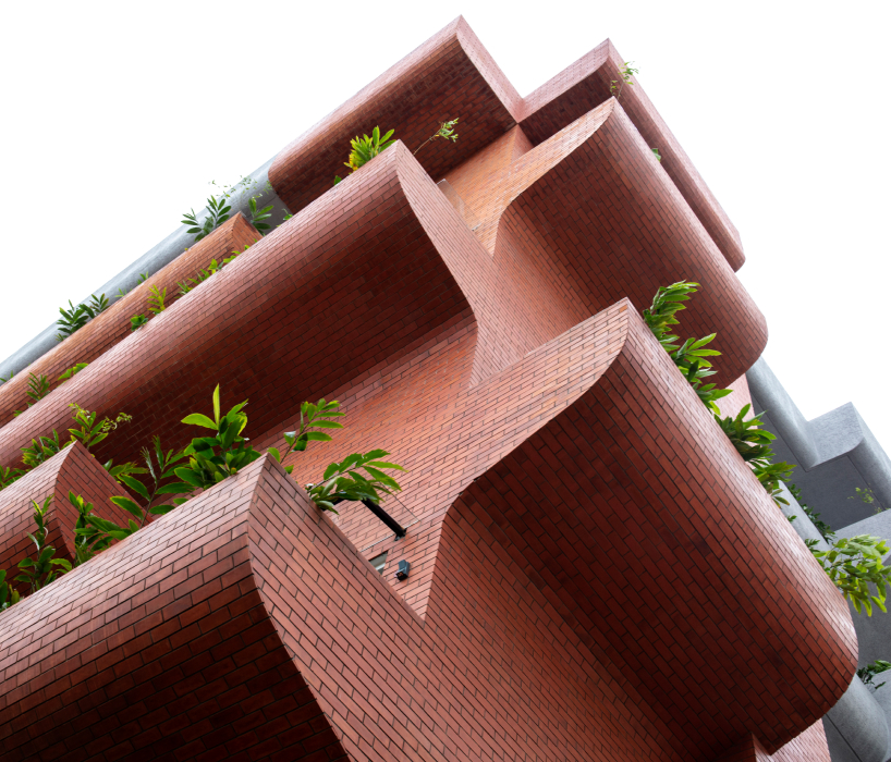 curving balconies double as environmental filters at purple ink studio's housing complex in bangalore