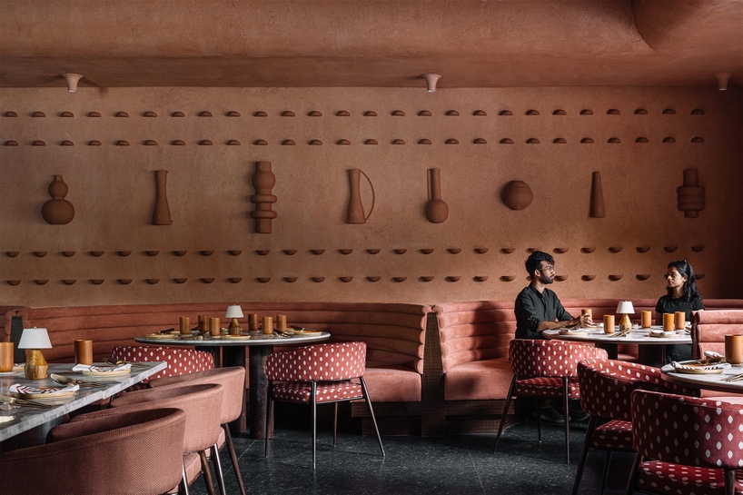 tactile earthen surfaces capture essence of jaipur at purple ink studio's idyll restaurant in bengaluru