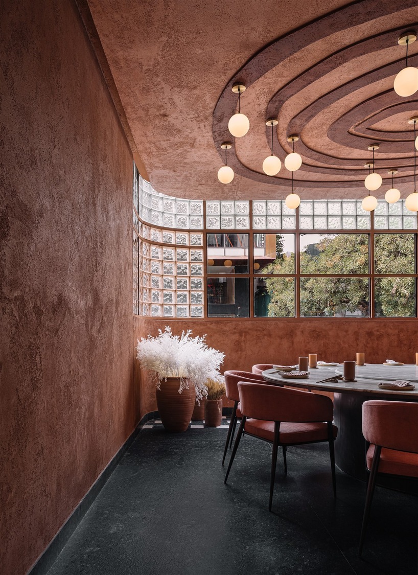 tactile earthen surfaces capture essence of jaipur at purple ink studio's idyll restaurant in bengaluru
