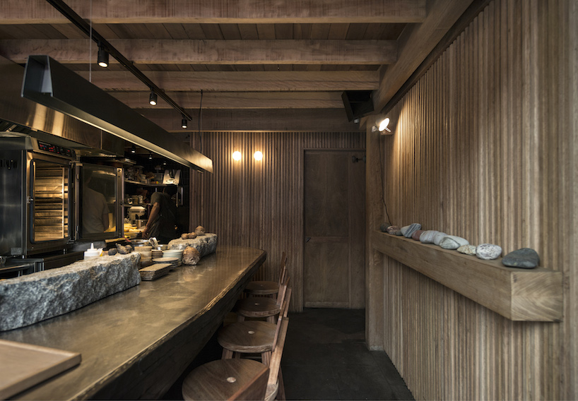 ghezzi novak and blanco use natural materials in cozy restaurant interior, lima
