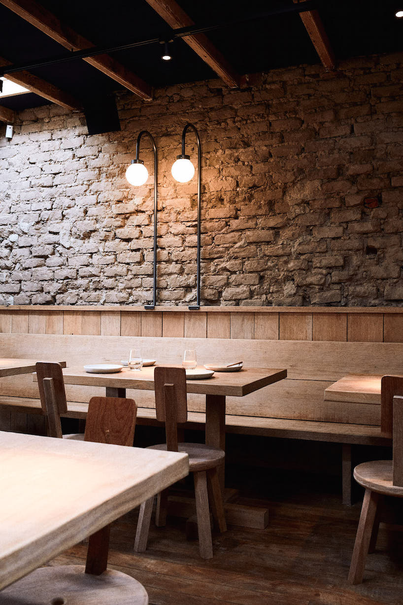 ghezzi novak and blanco use natural materials in cozy restaurant interior, lima