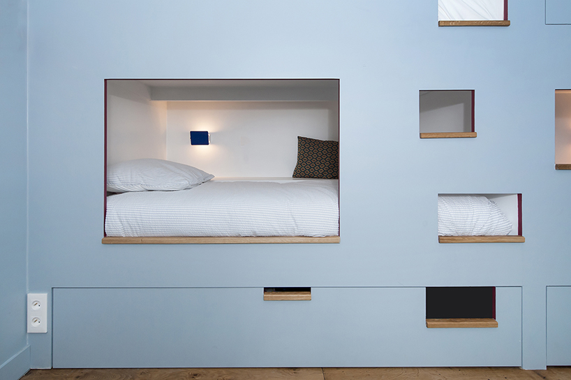 pierre-louis gerlier + marion duclos design meshes for sleeping in a bookcase designboom