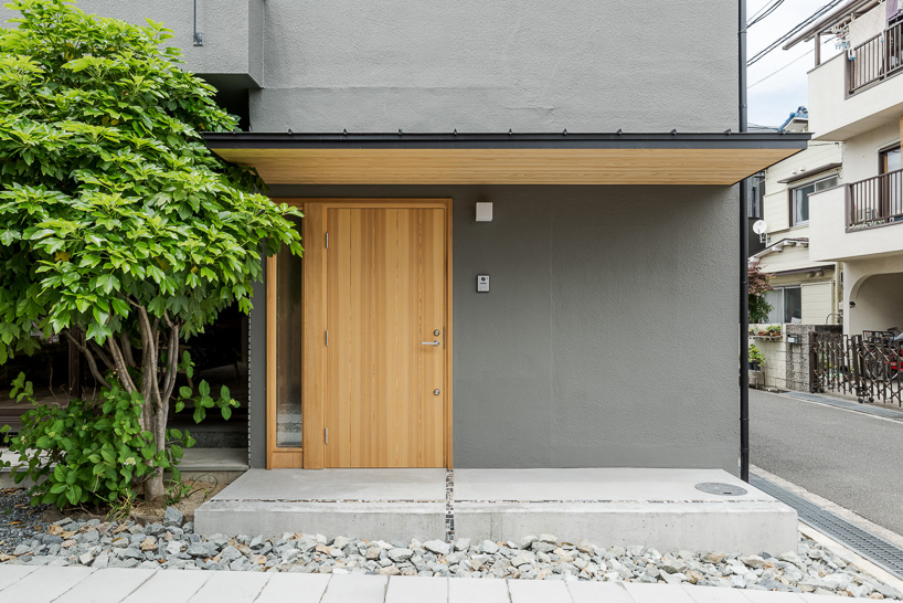 double-level foyer puts modern twist on traditional doma in coil Kazuteru Matumura Architects' re:teramoto house in itama