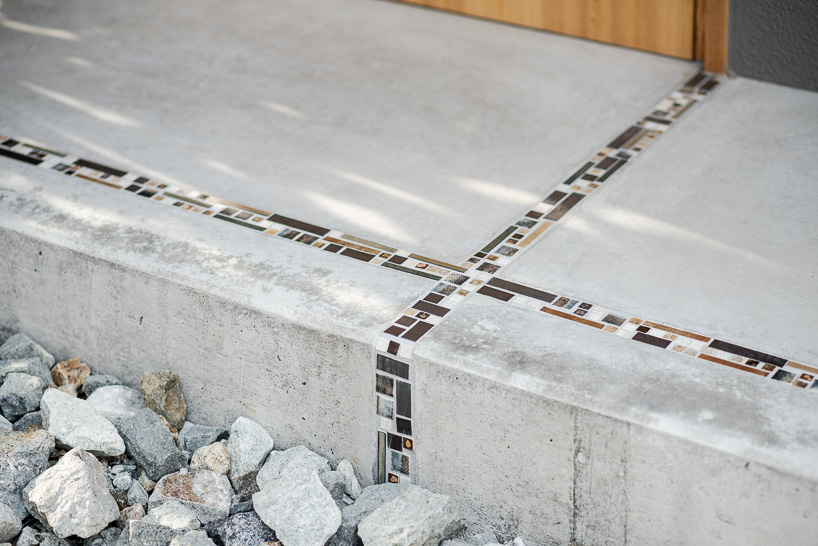 double-level foyer puts modern twist on traditional doma in coil Kazuteru Matumura Architects' re:teramoto house in itama