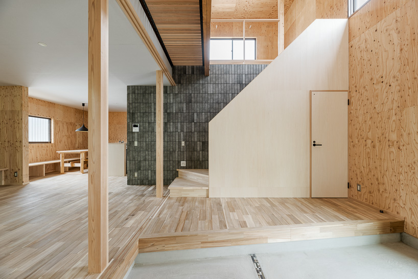 double-level foyer puts modern twist on traditional doma in coil Kazuteru Matumura Architects' re:teramoto house in itama