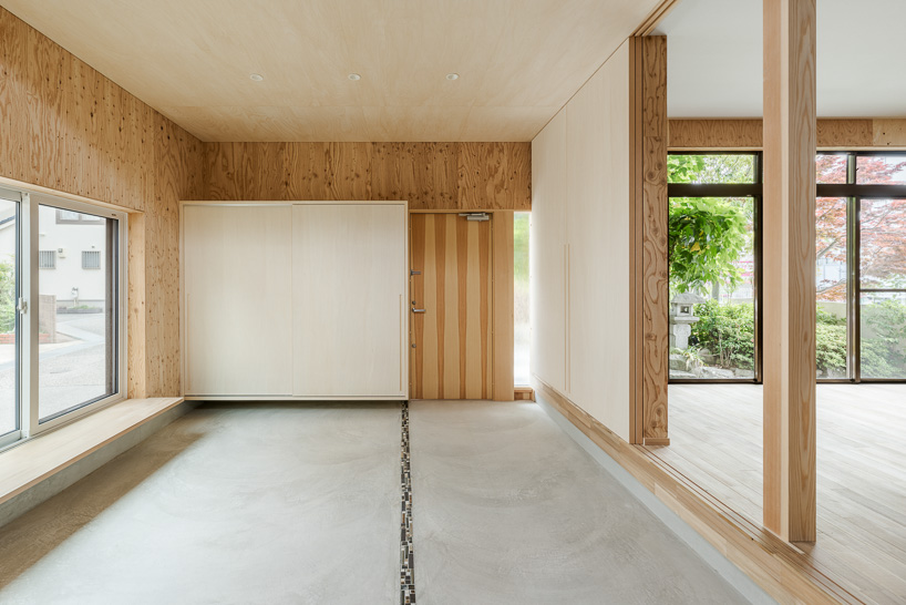 double-level foyer puts modern twist on traditional doma in coil Kazuteru Matumura Architects' re:teramoto house in itama