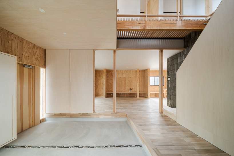 double-level foyer puts modern twist on traditional doma in coil Kazuteru Matumura Architects' re:teramoto house in itama