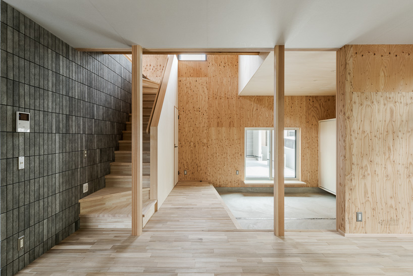double-level foyer puts modern twist on traditional doma in coil Kazuteru Matumura Architects' re:teramoto house in itama