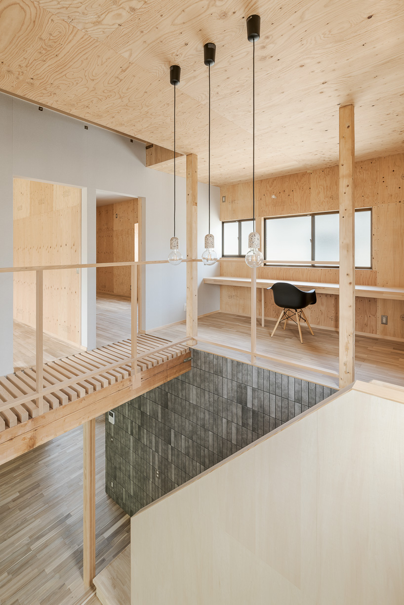 double-level foyer puts modern twist on traditional japanese doma in re:teramoto house in itama