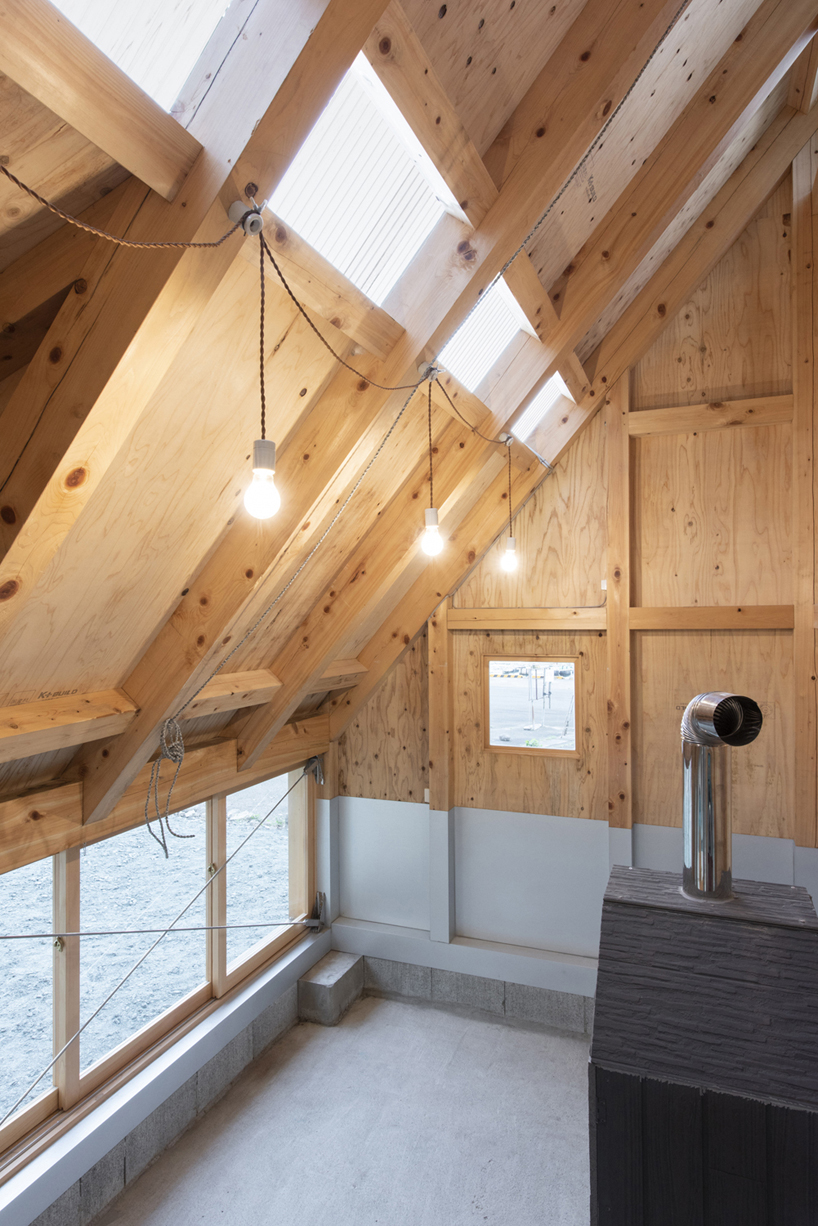 TD atelier's self-build fishing factory in japan with distinctive triangular roof