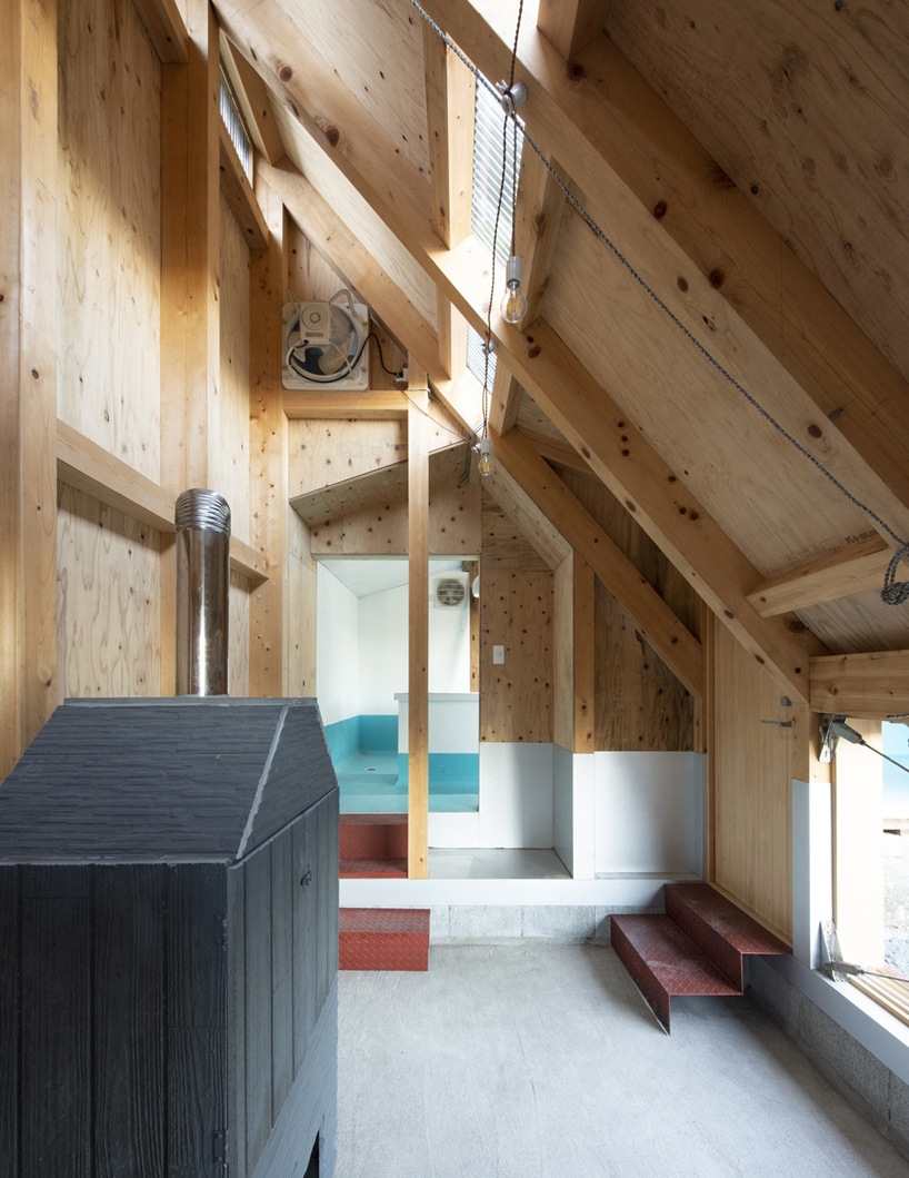 TD atelier's self-build fishing factory in japan with distinctive triangular roof