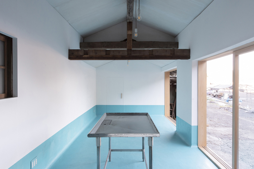 TD atelier's self-build fishing factory in japan with distinctive triangular roof