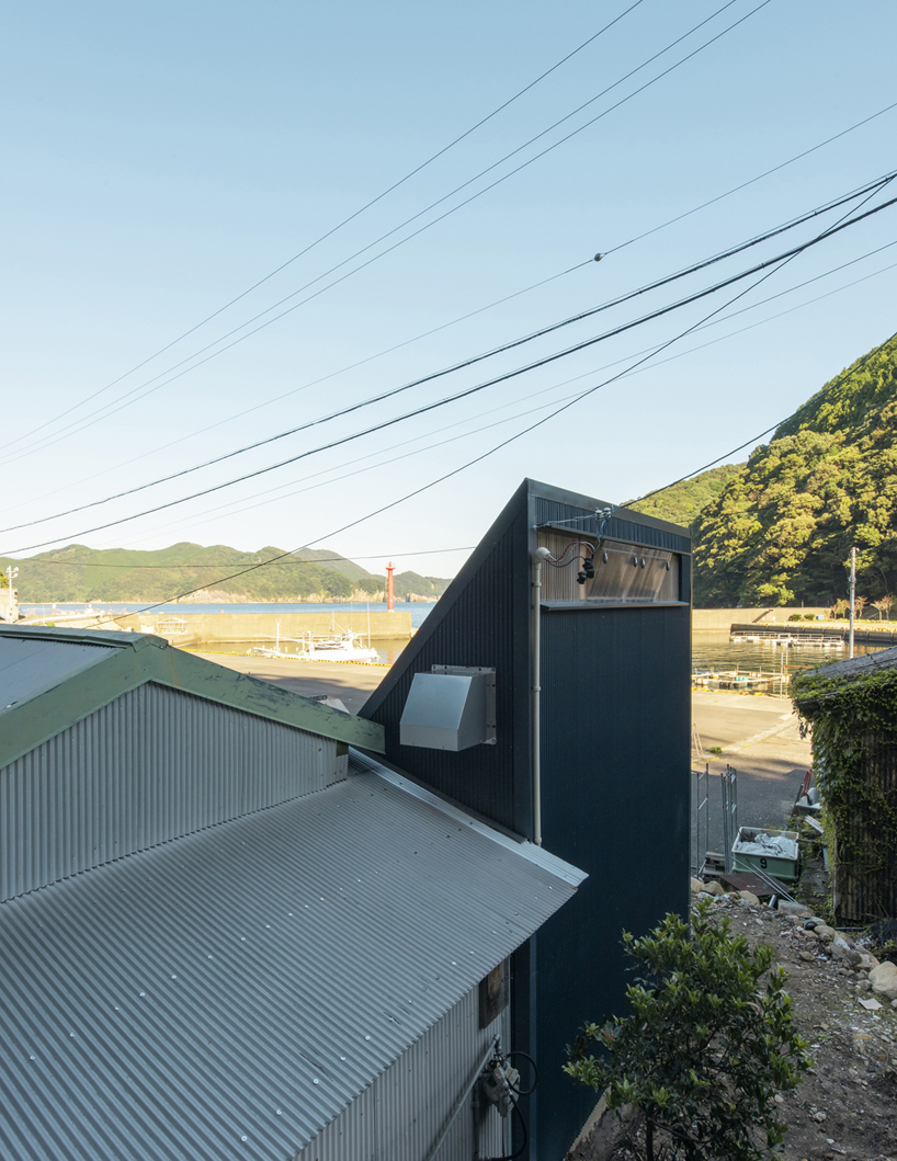 TD atelier's self-build fishing factory in japan with distinctive triangular roof