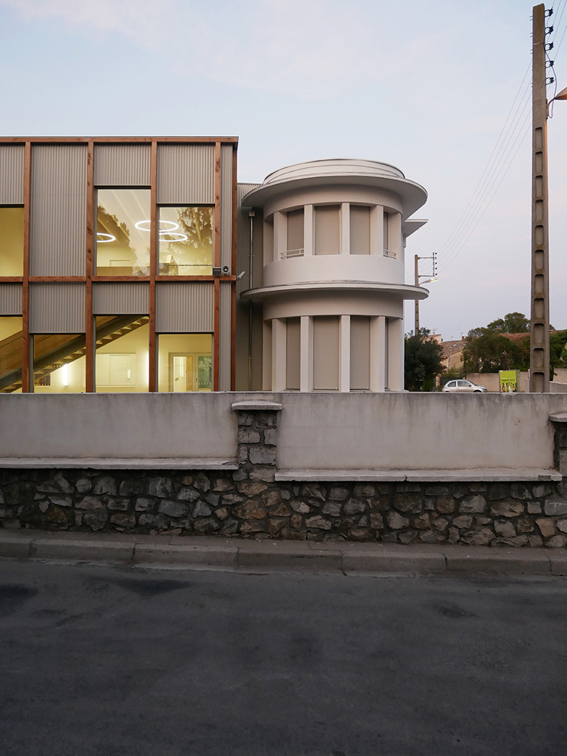 nas architectures primary school extension takes possession of the roof of an old public bath in saint gilles 2