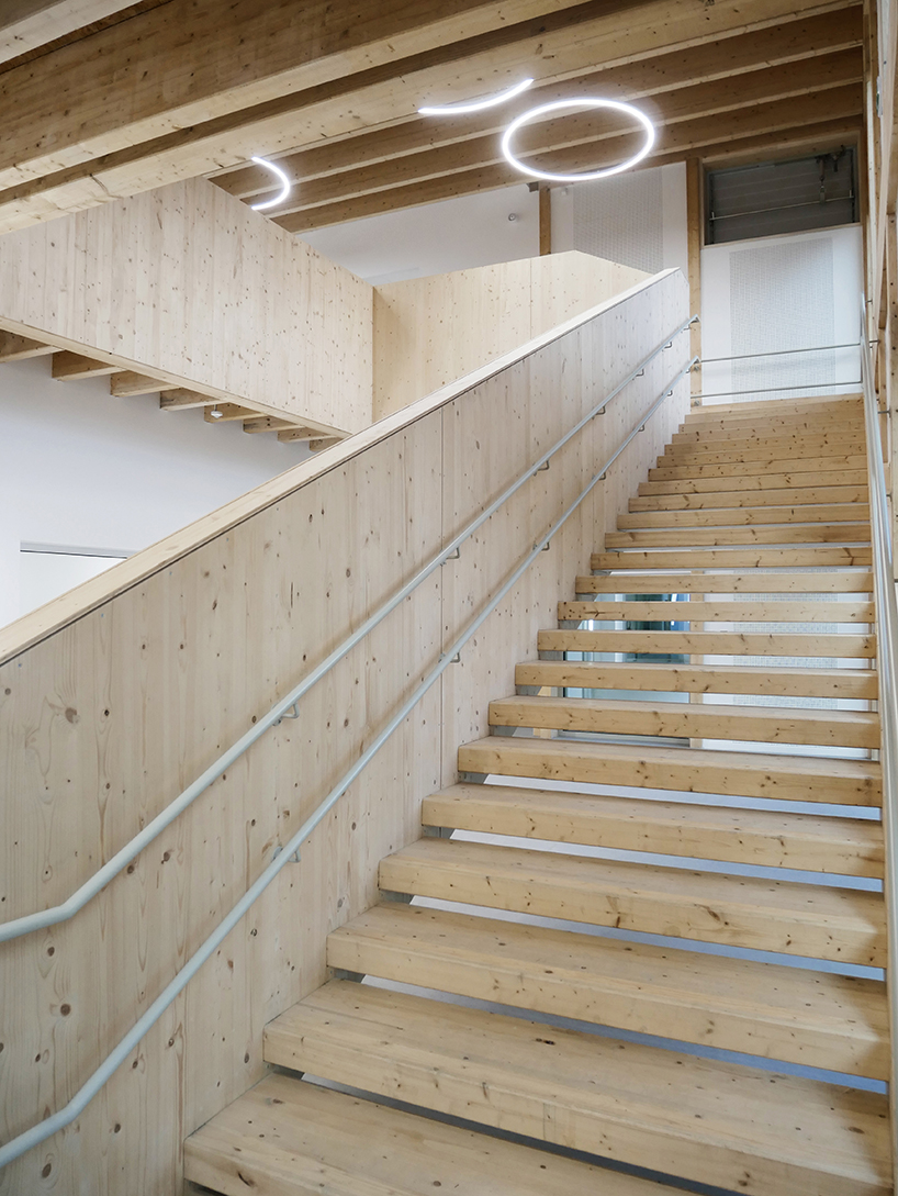 nas architectures primary school extension takes possession of the roof of an old public bath in saint gilles 5