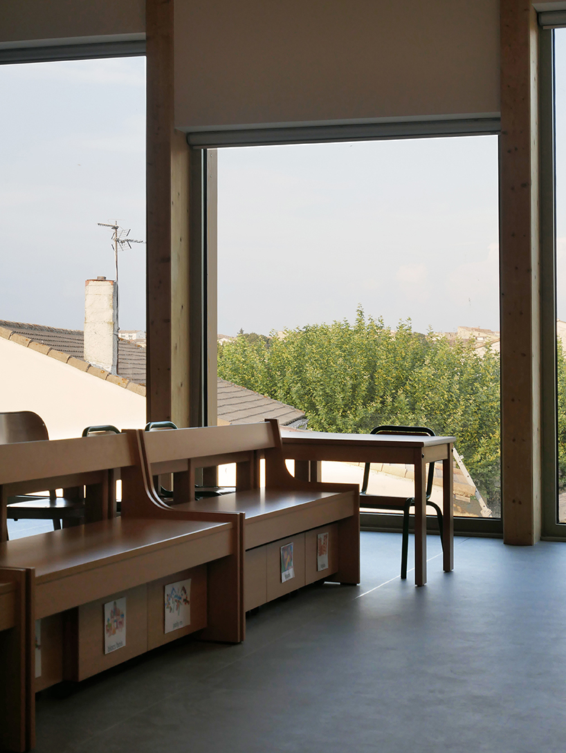 nas architectures primary school extension takes possession of the roof of an old public bath in saint gilles 8