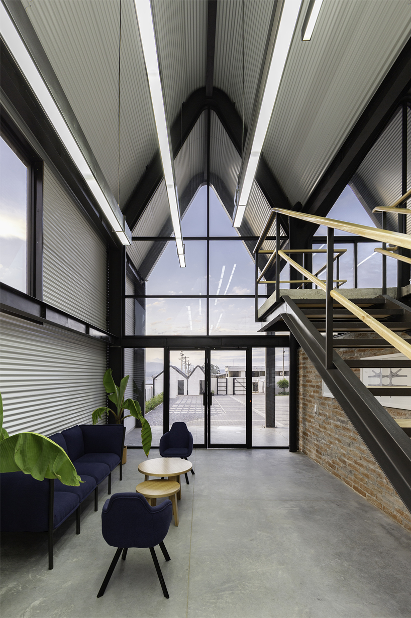 estudio felipe escudero designs a series of gable roofs clad in black aluminium