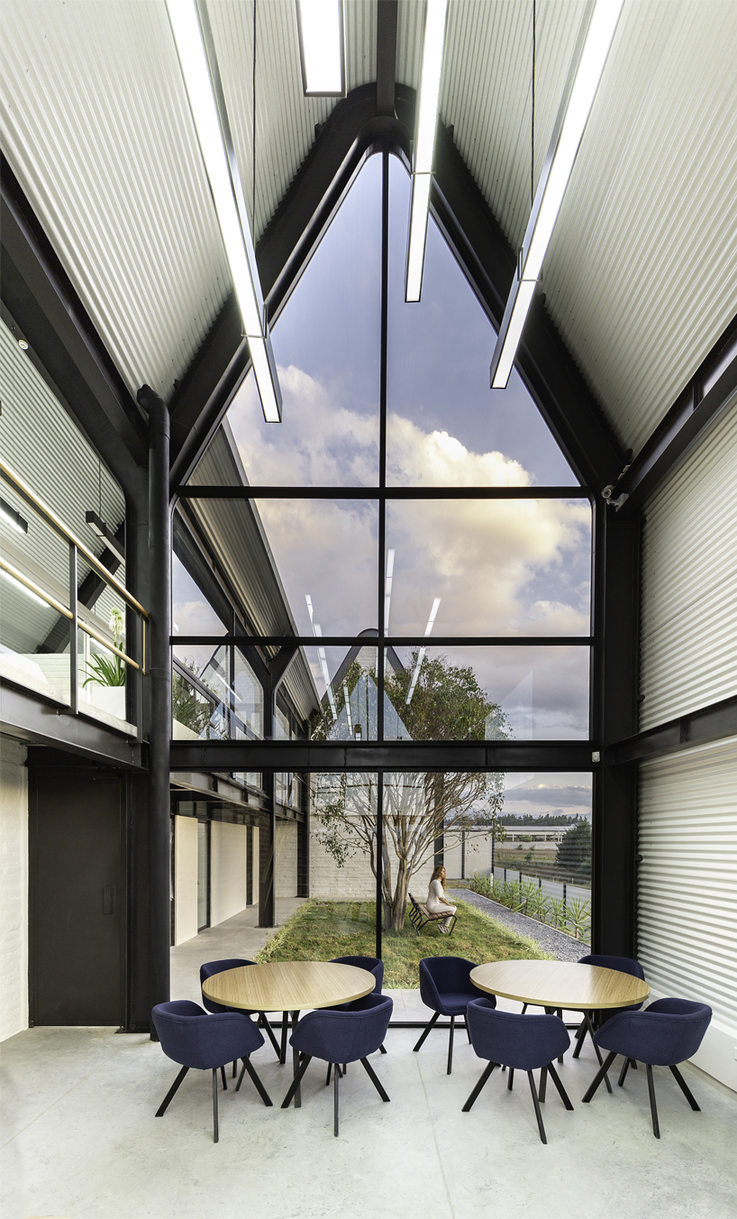 estudio felipe escudero designs a series of gable roofs clad in black aluminium