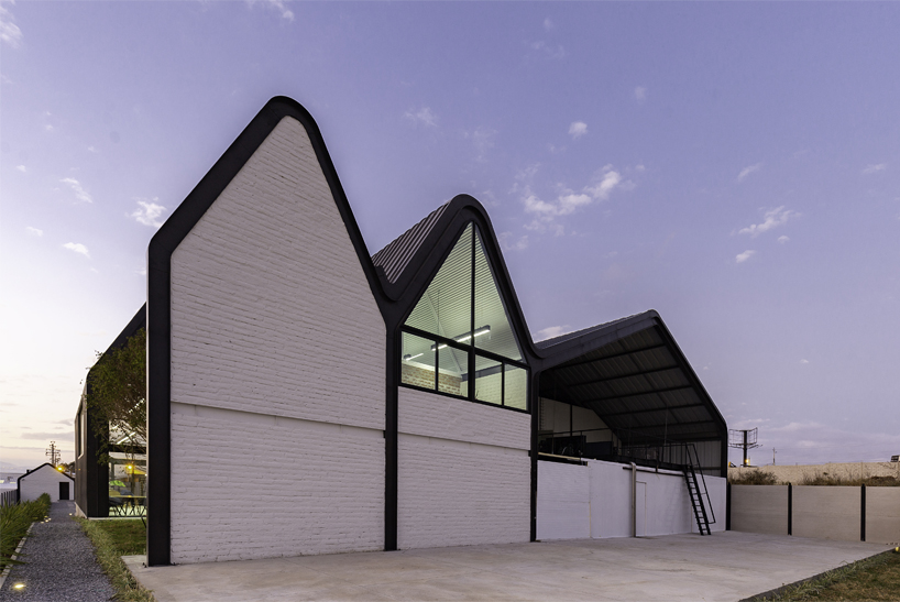 estudio felipe escudero designs a series of gable roofs clad in black aluminium