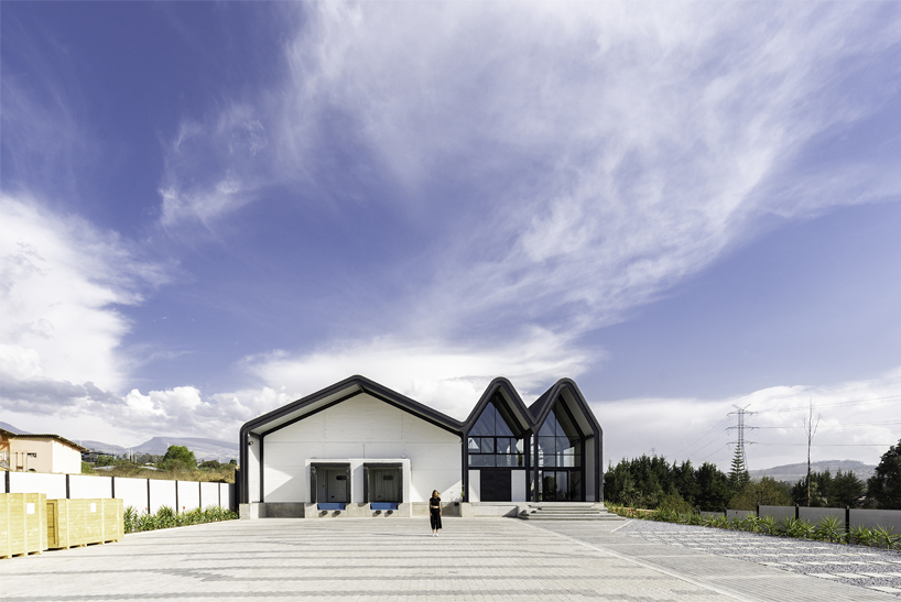 estudio felipe escudero designs a series of gable roofs clad in black aluminium