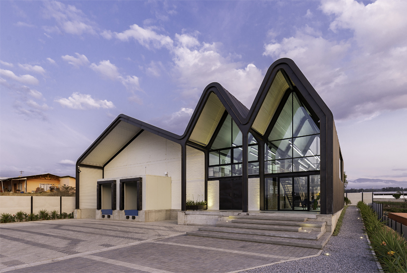 estudio felipe escudero designs a series of gable roofs clad in black aluminium