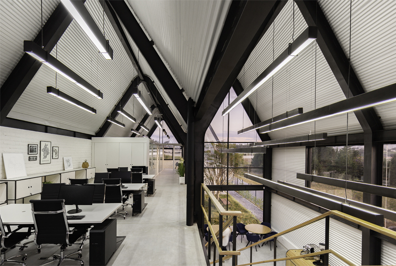 estudio felipe escudero designs a series of gable roofs clad in black aluminium