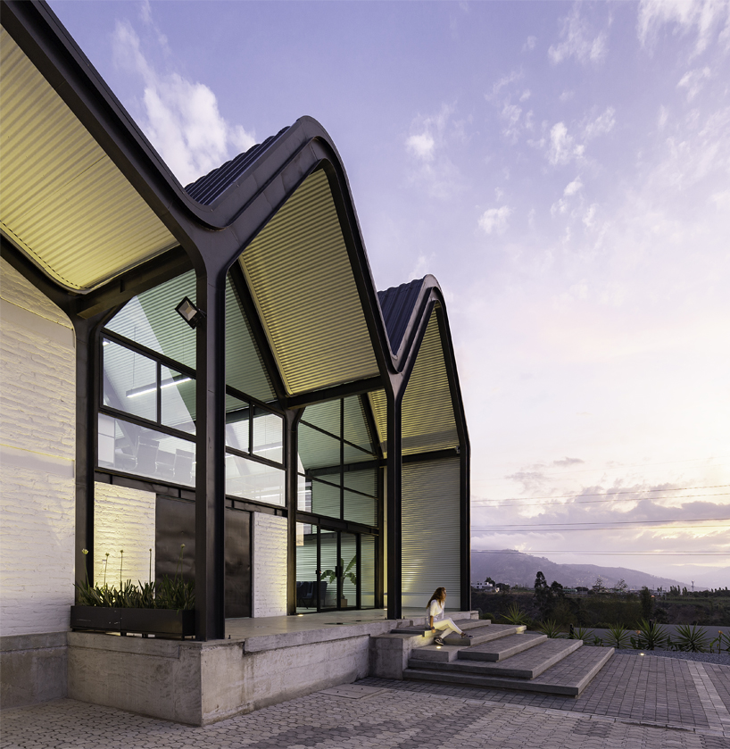 estudio felipe escudero designs a series of gable roofs clad in black aluminium