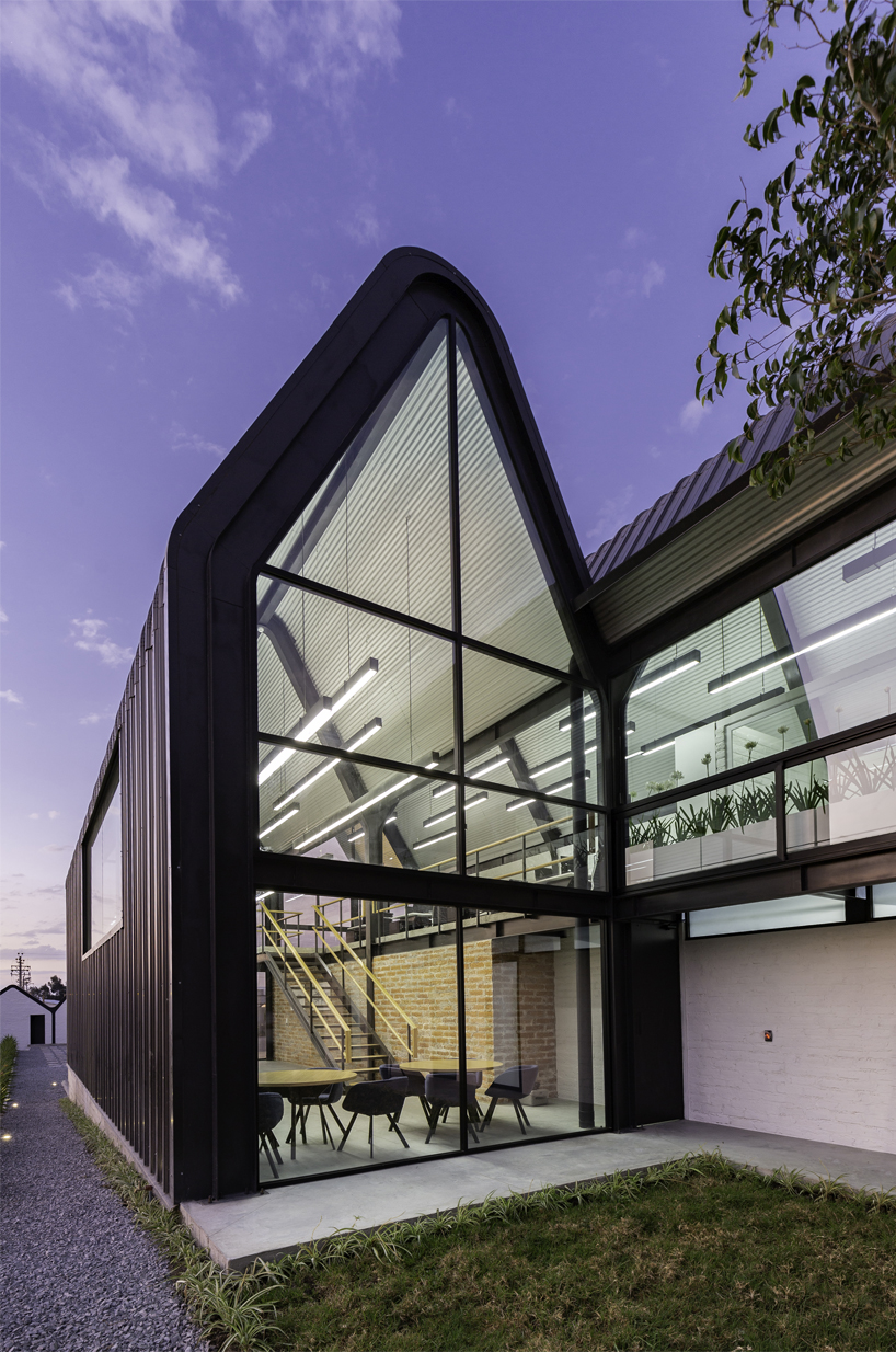 estudio felipe escudero designs a series of gable roofs clad in black aluminium