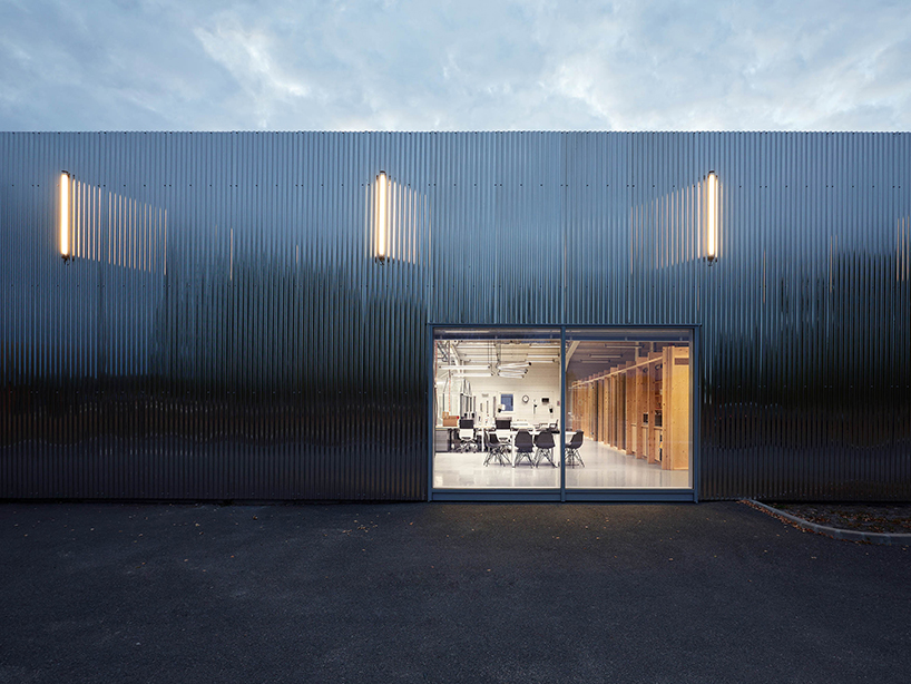 freaks wraps a double skin of corrugated stainless steel around office building in paris designboom