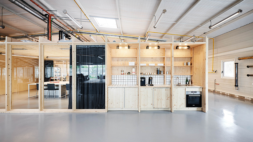 freaks wraps a double skin of corrugated stainless steel around office building in paris designboom