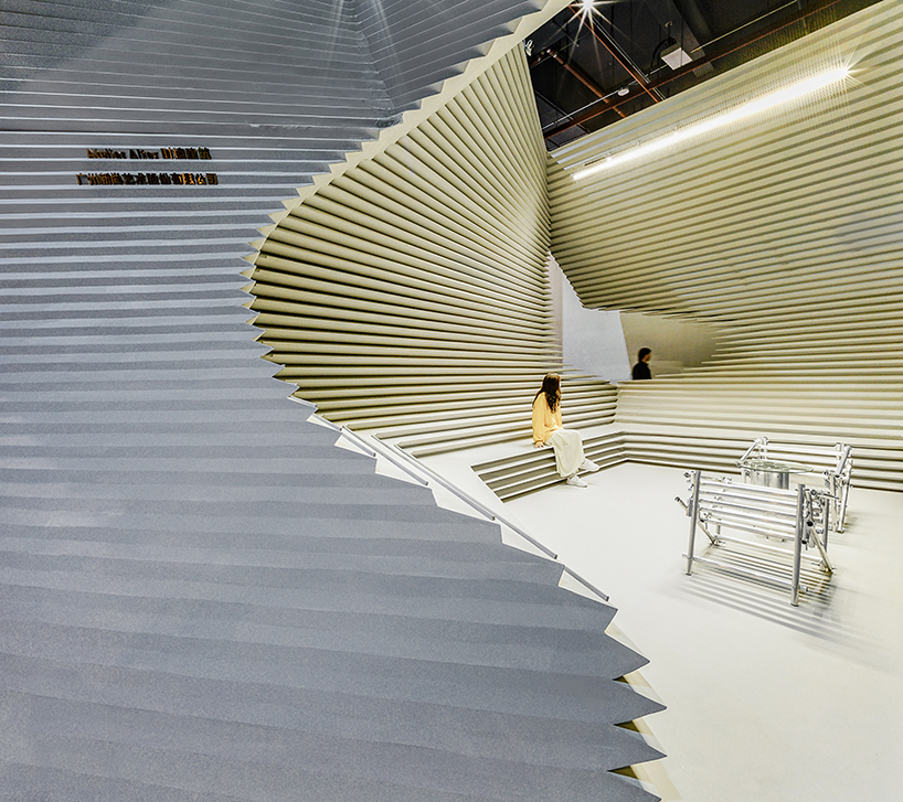 undulating exhibition pavilion can be reassembled to fulfill another function