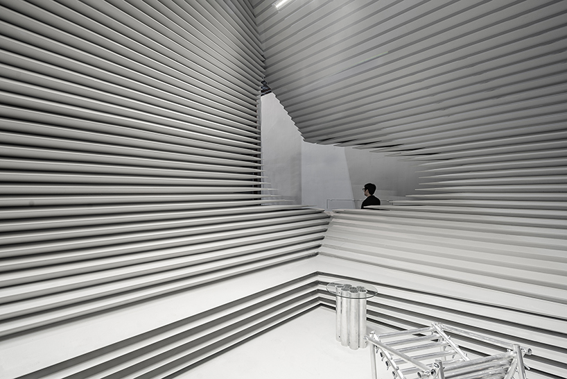 undulating exhibition pavilion can be reassembled to fulfill another function